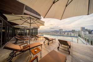 Outdoor pool, open 9:00 AM to 4:30 PM, pool umbrellas, sun loungers
