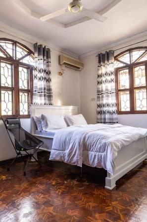 Executive Apartment | Blackout drapes, iron/ironing board, free WiFi