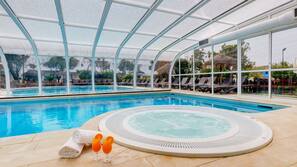 Indoor pool, outdoor pool, pool umbrellas, pool loungers