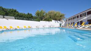 Indoor pool, outdoor pool, pool umbrellas, pool loungers