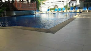 Outdoor pool, open 7 AM to 10 PM, pool umbrellas, pool loungers