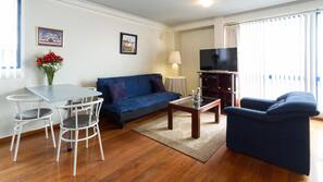 Flat-screen TV, DVD player, pay movies