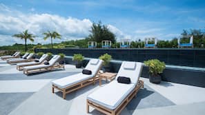 Outdoor pool, open 10:00 AM to 7:00 PM, free pool cabanas