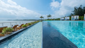Outdoor pool, open 10:00 AM to 7:00 PM, free pool cabanas