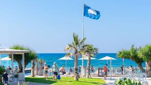 On the beach, sun loungers, beach umbrellas, beach towels