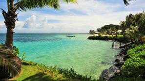 On the beach, white sand, sun loungers, snorkeling