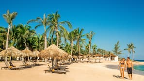 Private beach, white sand, sun loungers, beach umbrellas