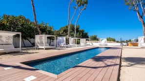 Indoor pool, outdoor pool, pool umbrellas, pool loungers