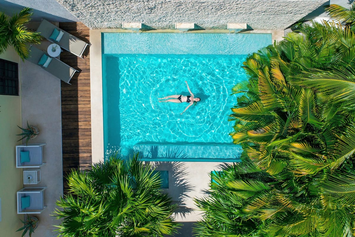 woma swimming in The Diplomat Boutique Hotel pool