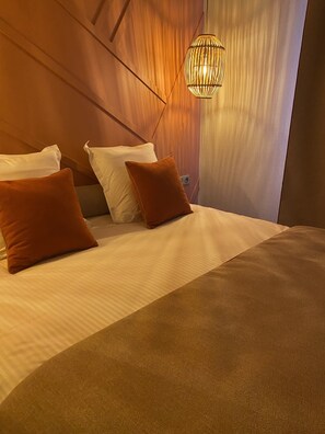 Suite (Terracotta) | Premium bedding, memory foam beds, in-room safe, desk