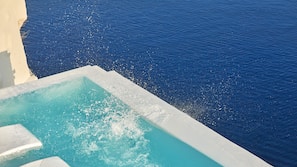 Seasonal outdoor pool, pool umbrellas, pool loungers