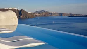 Seasonal outdoor pool, pool umbrellas, pool loungers
