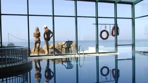 Indoor pool, outdoor pool, pool umbrellas, pool loungers