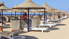 Private beach, sun-loungers, beach umbrellas, beach bar