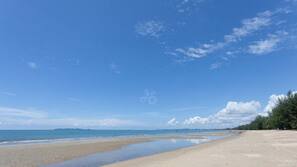 On the beach, sun-loungers, beach umbrellas, beach towels