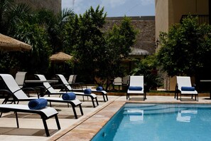 Outdoor pool, open 9:00 AM to 9:00 PM, pool umbrellas, sun loungers
