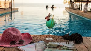 Seasonal outdoor pool, pool umbrellas, pool loungers