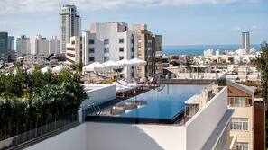 Seasonal outdoor pool, pool umbrellas, pool loungers
