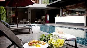 Outdoor pool, pool umbrellas, pool loungers