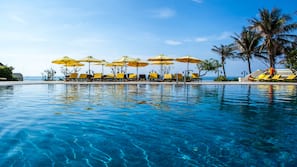 Indoor pool, outdoor pool, pool umbrellas, sun loungers