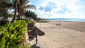Private beach, white sand, sun loungers, beach umbrellas