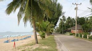 On the beach, sun-loungers, beach umbrellas