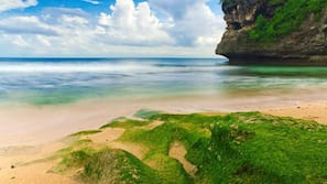 Beach nearby, white sand, beach towels, surfing