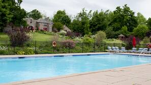Seasonal outdoor pool, open 8 AM to 8 PM, pool umbrellas, pool loungers