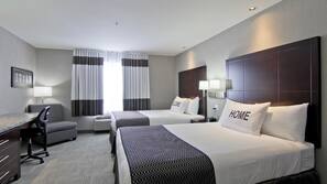 Premium bedding, desk, laptop workspace, blackout drapes