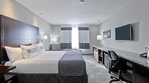 Premium bedding, desk, laptop workspace, blackout drapes
