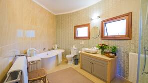 Separate tub and shower, deep soaking tub, free toiletries, hair dryer