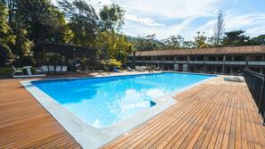 Outdoor pool, open 8:00 AM to 8:00 PM, pool loungers