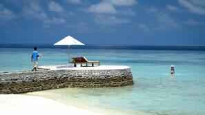 Private beach, white sand, free beach cabanas, sun loungers