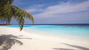 Private beach, white sand, free beach cabanas, sun loungers