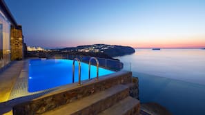 Outdoor pool, an infinity pool, pool loungers