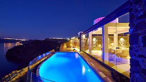 Outdoor pool, an infinity pool, pool loungers