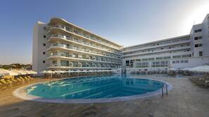 Seasonal outdoor pool, pool umbrellas, pool loungers