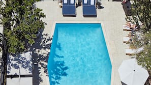 Outdoor pool, open 7 AM to 7 PM, pool umbrellas