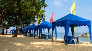 On the beach, sun loungers, beach umbrellas, beach towels