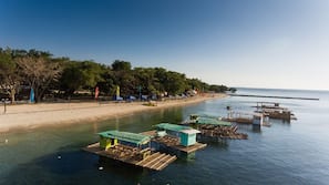 On the beach, sun loungers, beach umbrellas, beach towels