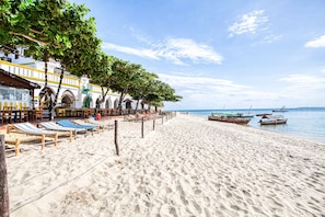 On the beach, white sand, beach shuttle, sun loungers