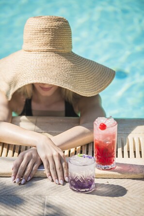Outdoor pool, open 11 AM to 4:00 PM, pool umbrellas, sun loungers