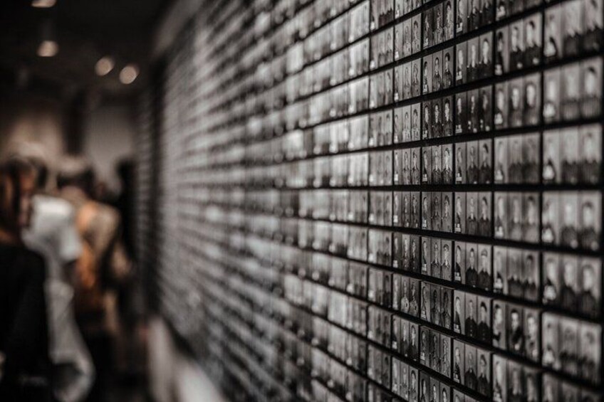 A wall of photographs. 5