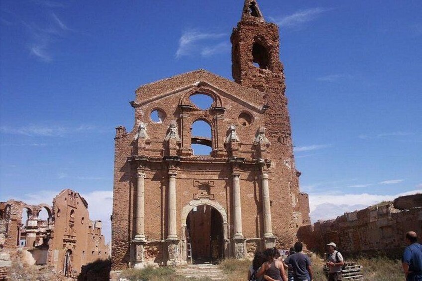 A large, historic church with a bell tower and arched windows. 4
