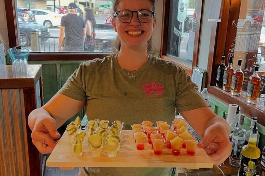 A person holding a tray with food items. 4