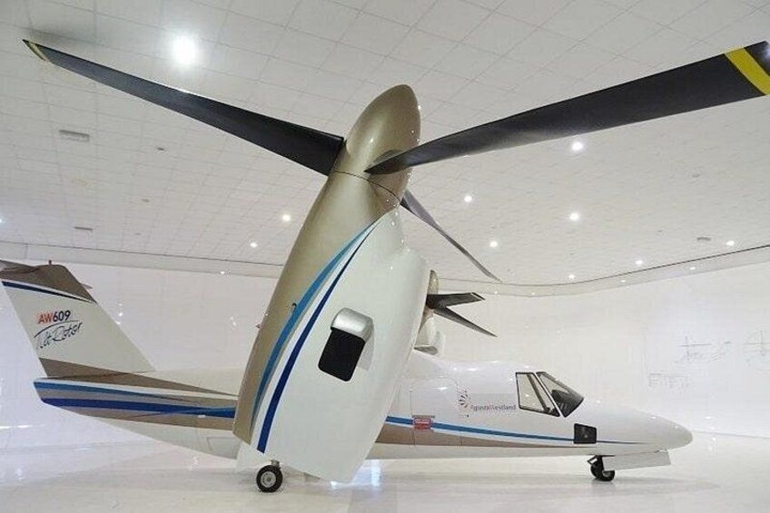A small aircraft with a propeller, a tail number AW609, and a registration number N12345. 1