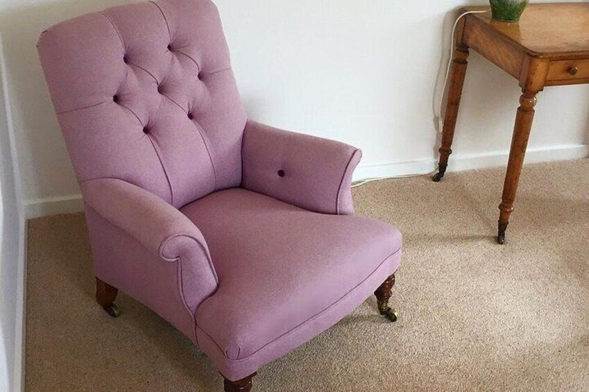 Deep buttoned armchair