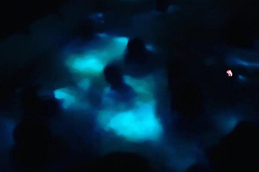 A dark scene with blue light patterns. 1