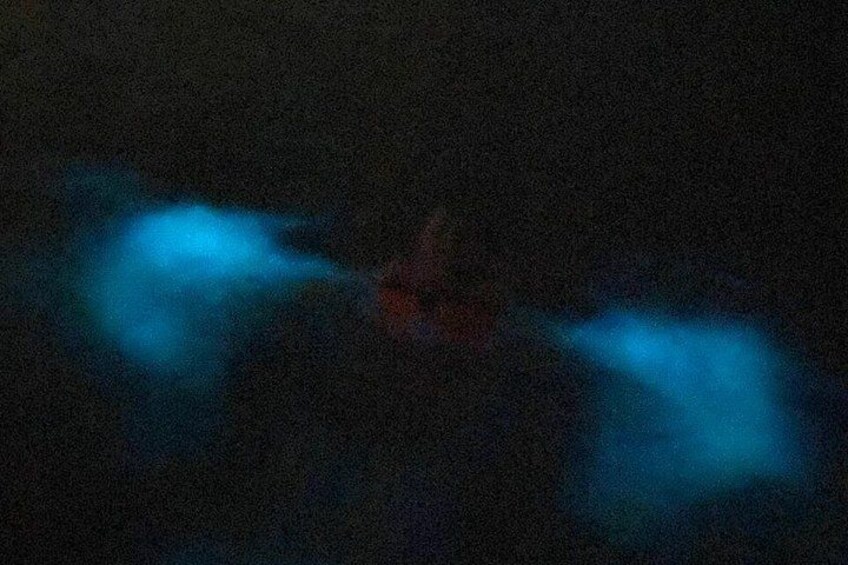 A dark scene with two blue light sources. 2