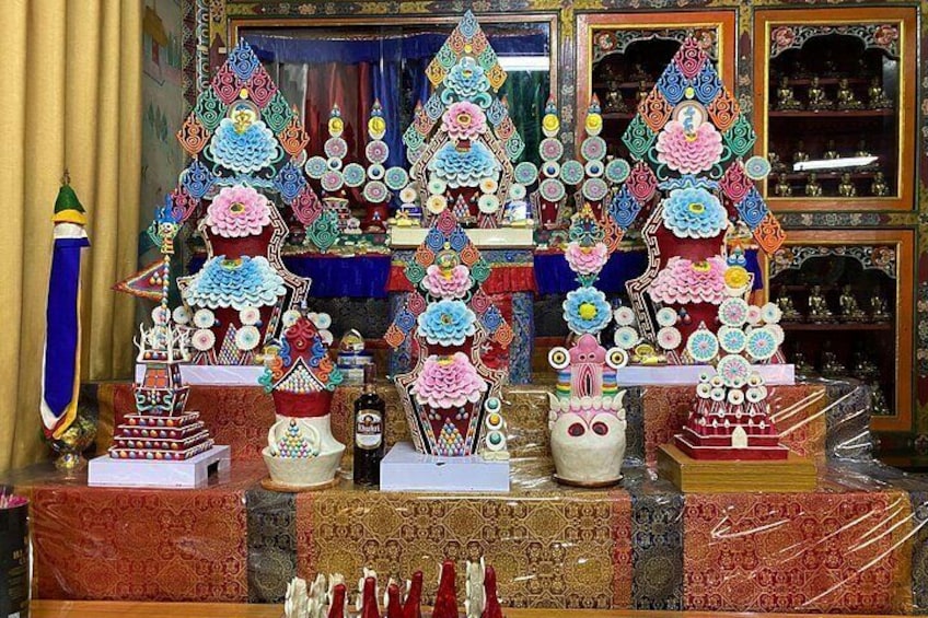A display of intricately decorated Christmas trees and other festive items. 2